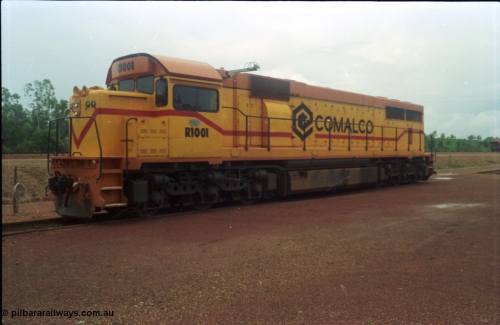 211-27
Weipa, Lorim Point railway workshops, 3/4 RHS or observer's side view of Comalco R 1001 loco Clyde Engineering EMD model GT26C serial 72-752 while is sits at the fuel point, items of note are these units were setup to have the long hood leading, the CCTV camera looking down the long hood, the second 'tropical roof' and the five chime horn cut into the nose. Also noticeable, the units don't have dynamic brakes fitted so there is no brake 'blister' in the middle of the hood like you see on the WAGR L or VR C classes which are also GT26C models.
Keywords: R1001;Clyde-Engineering;EMD;GT26C;72-752;1.001;Comalco;