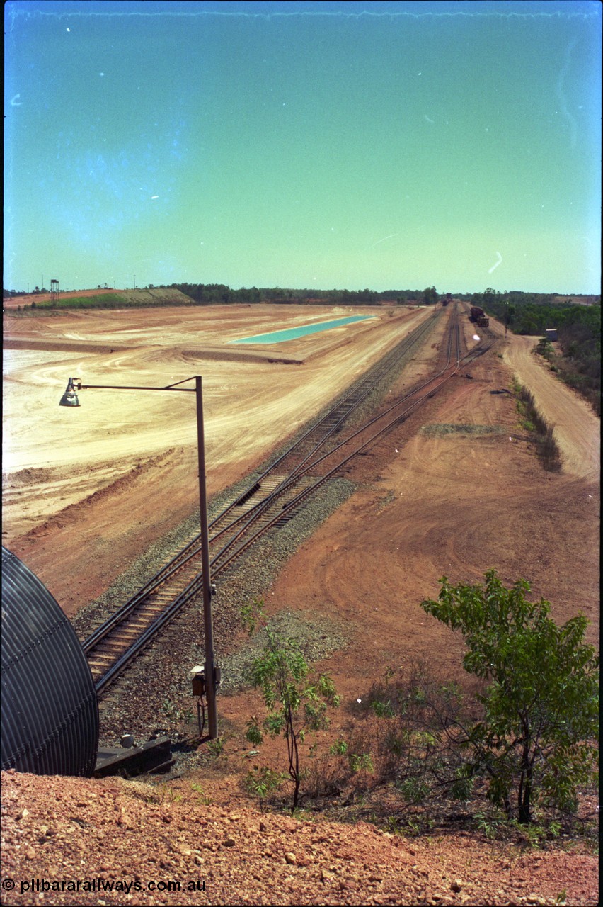 212-01
Weipa, view from the road overbridge looking towards the dump station and small yard that is Lorim Point, the dump station is in the far distance.
