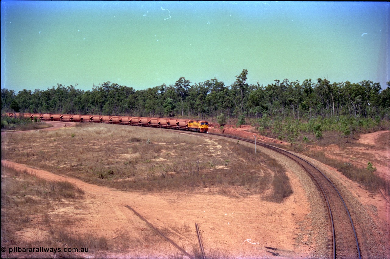 212-09
Weipa, a loaded train from Andoom Mine rounds the curve on approach to Lorim Point behind Comalco R 1004 Clyde Engineering EMD JT26C serial 90-1277 which is former Goldsworthy Mining loco GML 10.
Keywords: R1004;Clyde-Engineering-Kelso-NSW;EMD;JT26C;90-1277;Comalco;GML10;Cinderella;GML-class;