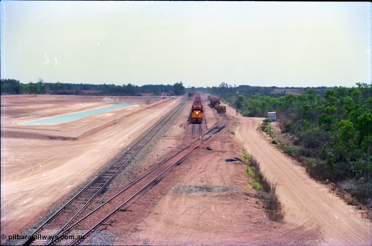 212-24
Weipa, empty train departing Lorim Point for another run to the mine at Andoom behind Comalco R 1001 Clyde Engineering built EMD model GT26C serial 72-752 originally numbered 1.001 and built in 1972. July 1995.
Keywords: R1001;Clyde-Engineering;EMD;GT26C;72-752;1.001;Comalco;