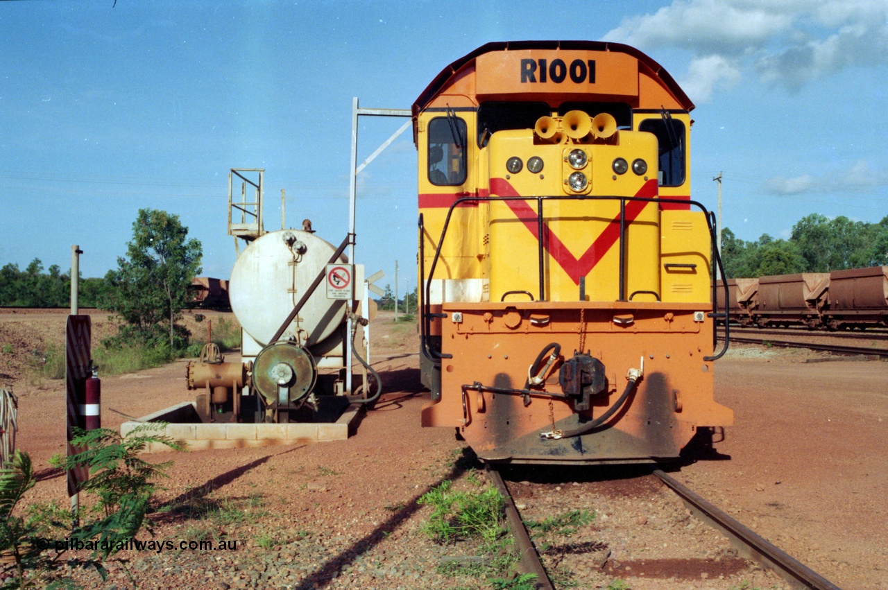 213-01
Weipa, Lorim Point workshops looking east, Comalco R 1001 loco Clyde Engineering built EMD model GT26C serial 72-752 sits at the fuel point, items of note are these units were setup to have the long hood leading, the second 'tropical roof' and the five chime horn cut into the nose. This unit is almost identical to the GT26C models of the WAGR L class. September 1995.
Keywords: R1001;Clyde-Engineering;EMD;GT26C;72-752;1.001;Comalco;