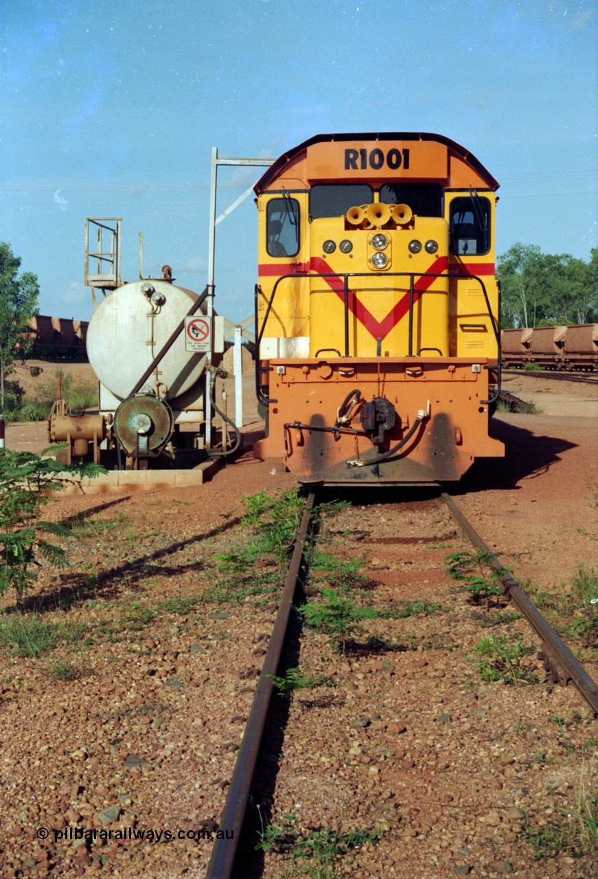 213-02
Weipa, Lorim Point workshops looking east, Comalco R 1001 loco Clyde Engineering built EMD model GT26C serial 72-752 sits at the fuel point, items of note are these units were setup to have the long hood leading, the second 'tropical roof' and the five chime horn cut into the nose. This unit is almost identical to the GT26C models of the WAGR L class. September 1995.
Keywords: R1001;Clyde-Engineering;EMD;GT26C;72-752;1.001;Comalco;