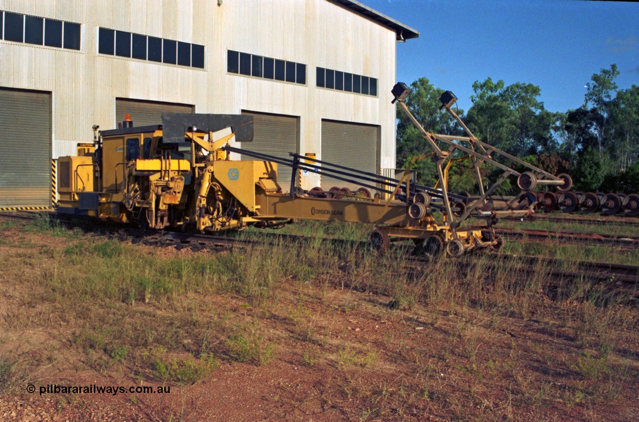 213-15
Weipa, Lorim Point workshops building, looking south east at the rear of the building. Canron Rail Group Mk I switch tamper. Canron was taken over by Harsco in 1990-91.
Keywords: Canron;track-machine;