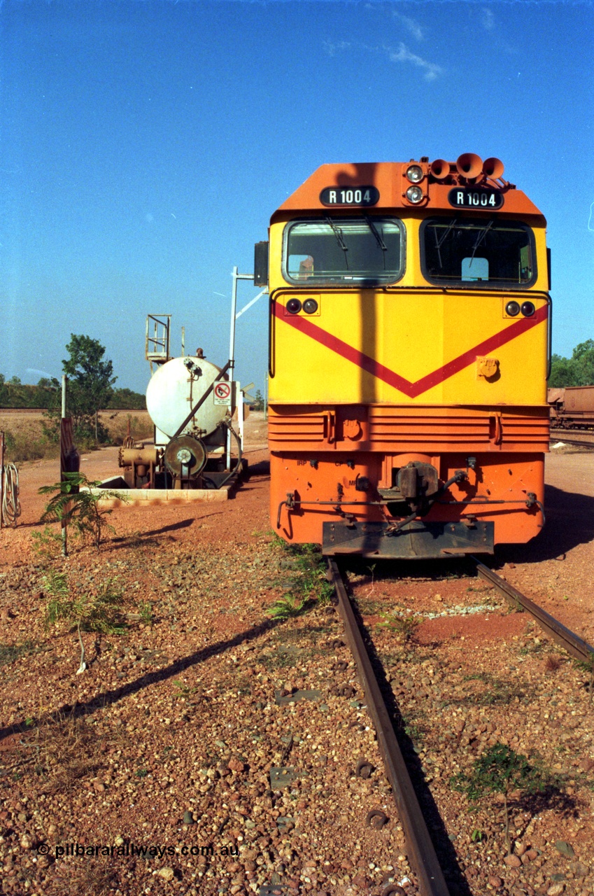 213-21
Weipa, Lorim Point fuel point, Comalco R 1004 loco Clyde Engineering built EMD model JT42C built 1990 serial 90-1277, weight 132 tonne, engine 12-710G3A, generator AR11-WBA-CA5, traction motors D87ETR, rated power 2460 kW/3300 hp. The body is similar to a V/Line N class while the components are the same as the Australian National AN class. Originally built for Goldsworthy Mining as GML 10 for use at their Western Australian iron ore railway and locally known as Cinderella. Purchased by Comalco in 1994 following the takeover of Goldsworthy by BHP.
Keywords: R1004;Clyde-Engineering-Kelso-NSW;EMD;JT26C;90-1277;Comalco;GML10;Cinderella;GML-class;