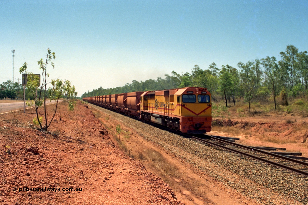 213-34
Weipa, a loaded train from Andoom near Northern Avenue with Comalco R 1004 leading thirty three loaded waggons of bauxite.
Keywords: R1004;Clyde-Engineering-Kelso-NSW;EMD;JT26C;90-1277;Comalco;GML10;Cinderella;GML-class;
