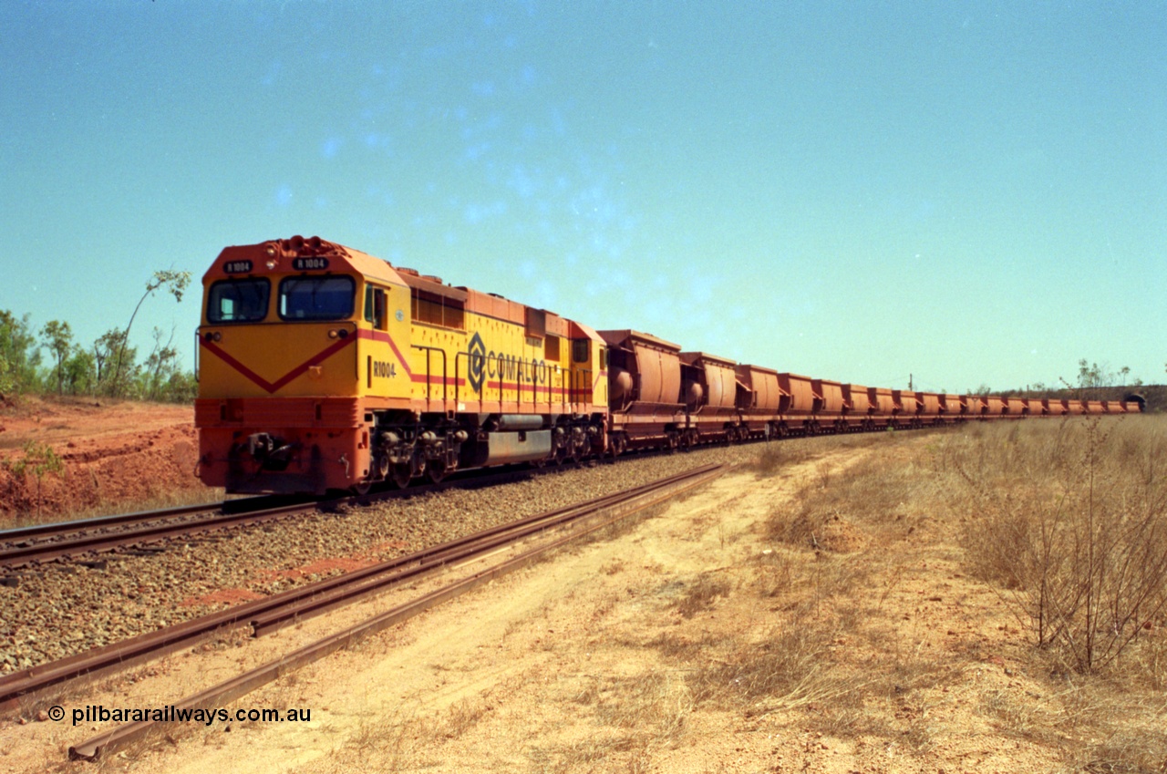 213-36
Weipa, an empty train departs Lorim Point behind Comalco R 1004 a Clyde Engineering built EMD model JT42C built 1990 serial 90-1277 originally as GML 10 for Goldsworthy Mining in Western Australia, bought by Comalco in 1994.
Keywords: R1004;Clyde-Engineering-Kelso-NSW;EMD;JT26C;90-1277;Comalco;GML10;Cinderella;GML-class;
