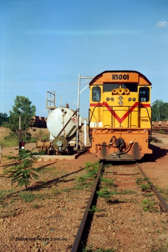 213-03
Weipa, Lorim Point workshops looking east, Comalco R 1001 loco Clyde Engineering built EMD model GT26C serial 72-752 sits at the fuel point, items of note are these units were setup to have the long hood leading, the second 'tropical roof' and the five chime horn cut into the nose. This unit is almost identical to the GT26C models of the WAGR L class. September 1995.
Keywords: R1001;Clyde-Engineering;EMD;GT26C;72-752;1.001;Comalco;
