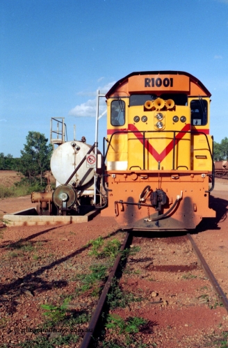 213-12
Weipa, Lorim Point workshops, Comalco R 1001 loco Clyde Engineering built EMD model GT26C serial 72-752 sits at the fuel point, items of note are these units were setup to have the long hood leading, the second 'tropical roof' and the five chime horn cut into the nose. This unit is almost identical to the GT26C models of the WAGR L class. September 1995.
Keywords: R1001;Clyde-Engineering;EMD;GT26C;72-752;1.001;Comalco;