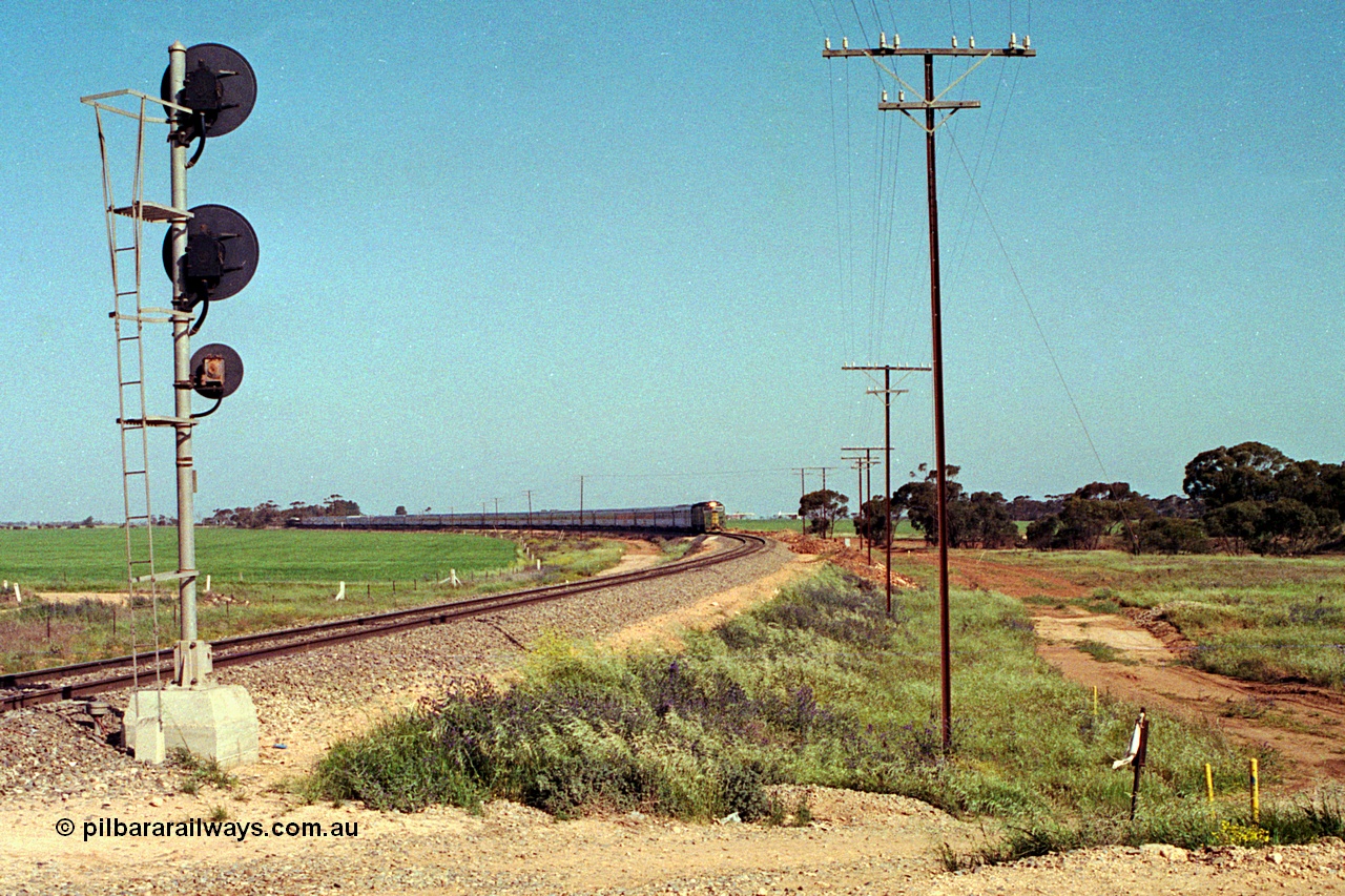 215-01
Long Plains, the down passenger train to Alice Springs 'The Ghan' on approach with power from an AN livered DL class DL 37 Clyde Engineering EMD model AT42C serial 88-1245.
Keywords: DL-class;DL37;Clyde-Engineering-Kelso-NSW;EMD;AT42C;88-1245;
