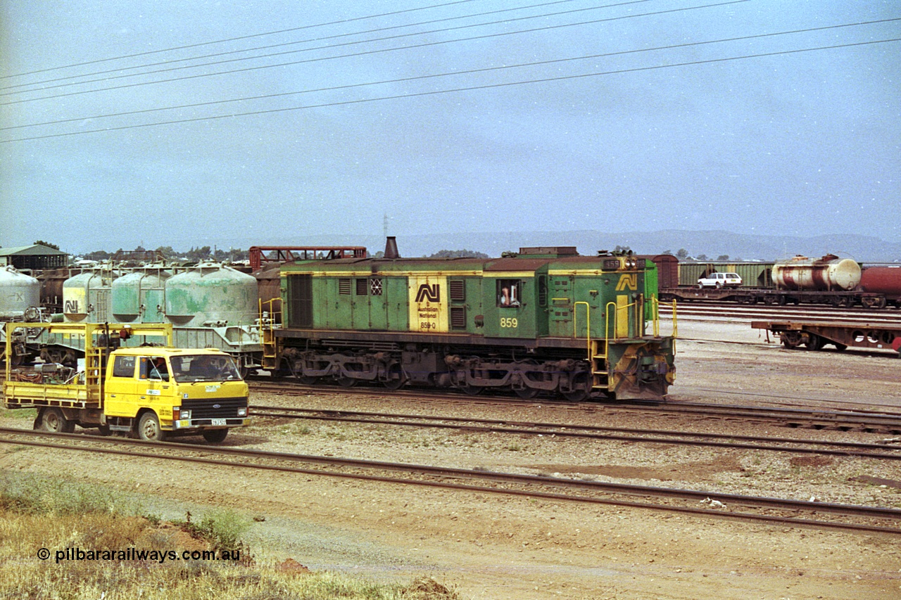215-06
Port Augusta, AN liveried 830 class locomotive 859 AE Goodwin ALCo model DL531 serial 84705 performs shunting duties in the yard.
Keywords: 830-class;859;AE-Goodwin;ALCo;DL531;84705;