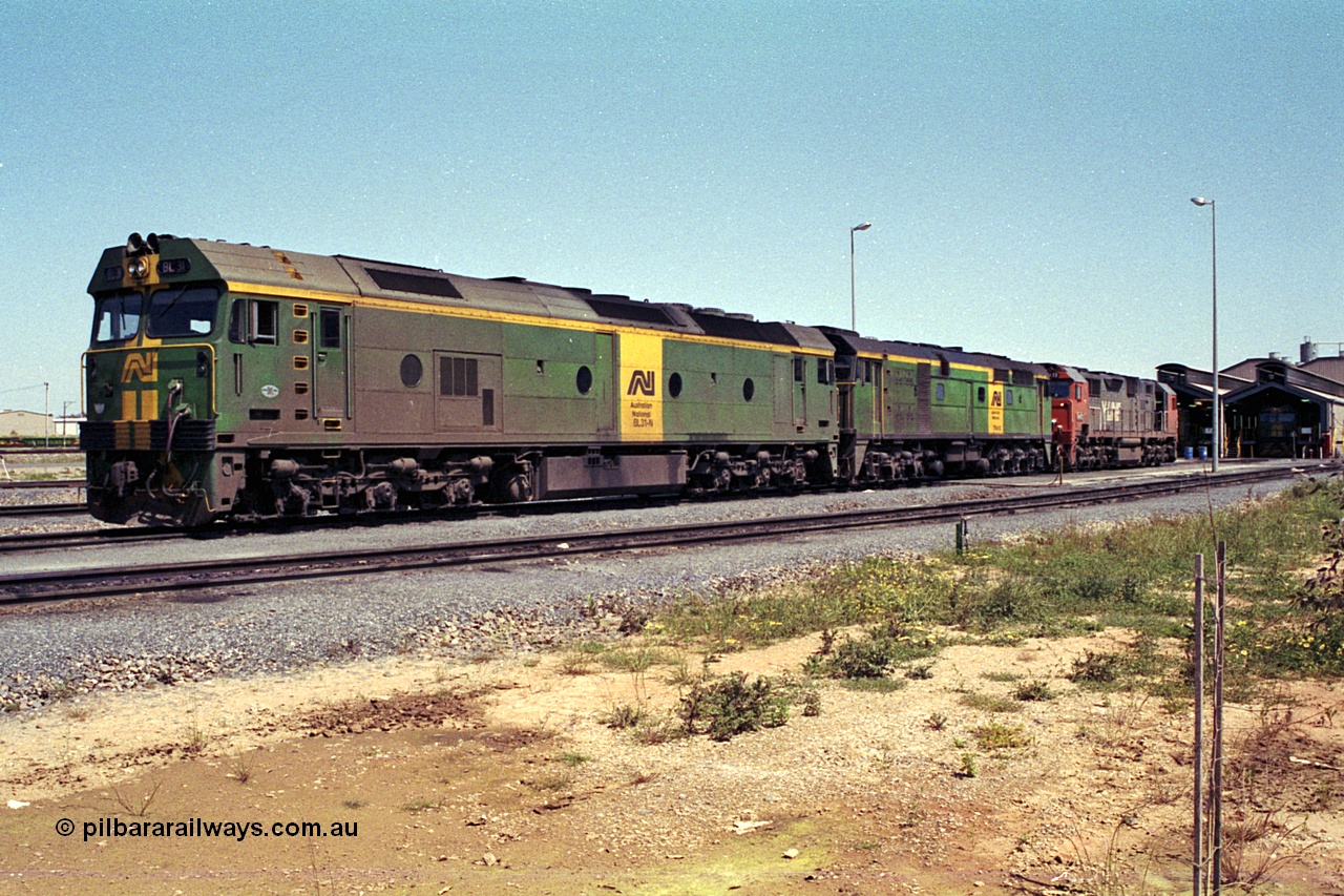 215-20
Dry Creek Motive Power Centre, fuel point roads, AN BL class BL 31 Clyde Engineering EMD model JT26C-2SS serial 83-1015 with 700 class 704 AE Goodwin ALCo model DL500G serial G6059-2 rest between jobs with V/Line broad gauge N class behind them.
Keywords: BL-class;BL31;Clyde-Engineering-Rosewater-SA;EMD;JT26C-2SS;83-1015;