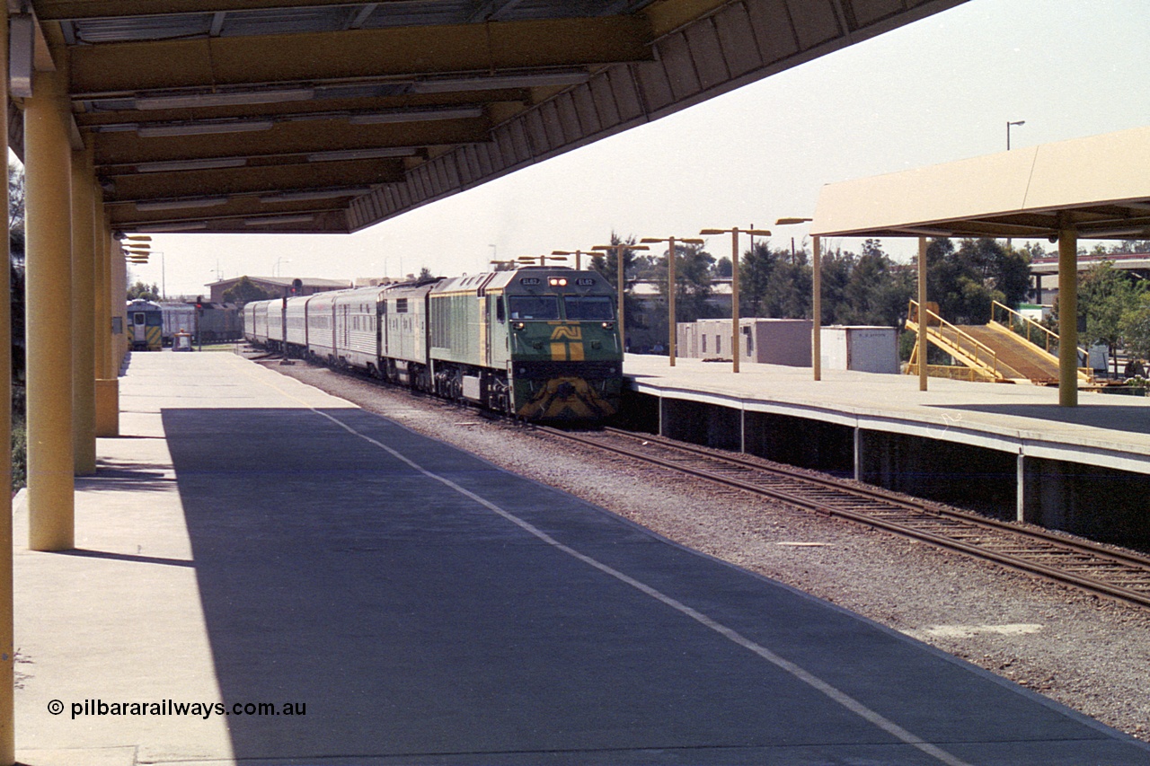 215-29
Keswick, the Australian National Adelaide interstate passenger terminal with the Indian Pacific arriving behind EL class EL 62 Goninan built General Electric CM30-8 serial 8013-07/90-114 with a GM class as second unit.
Keywords: EL-class;EL62;Goninan;GE;CM30-8;8013-07/90-114;