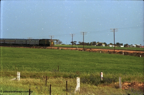 216-01
Long Plains, the down passenger train to Alice Springs 'The Ghan' on approach with power from an AN livered DL class DL 37 Clyde Engineering EMD model AT42C serial 88-1245.
Keywords: DL-class;DL49;Clyde-Engineering-Kelso-NSW;EMD;AT42C;89-1268;
