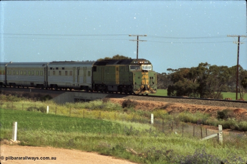 216-03
Long Plains, the down passenger train to Alice Springs 'The Ghan' on approach with power from an AN livered DL class DL 37 Clyde Engineering EMD model AT42C serial 88-1245.
Keywords: DL-class;DL49;Clyde-Engineering-Kelso-NSW;EMD;AT42C;89-1268;