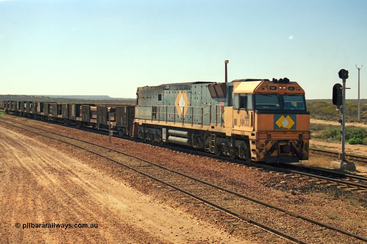 244-12
Port Augusta, Spencer Junction NR class NR 22 leads an UP short four waggon steel train off the Whyalla line. NR 22 is a Goninan built GE model Cv40-9i serial 7250-04/97-224.
