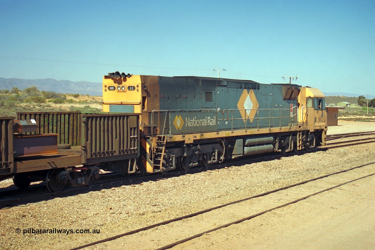 244-13
Port Augusta, Spencer Junction NR class NR 22 leads an UP short four waggon steel train off the Whyalla line. NR 22 is a Goninan built GE model Cv40-9i serial 7250-04/97-224.

