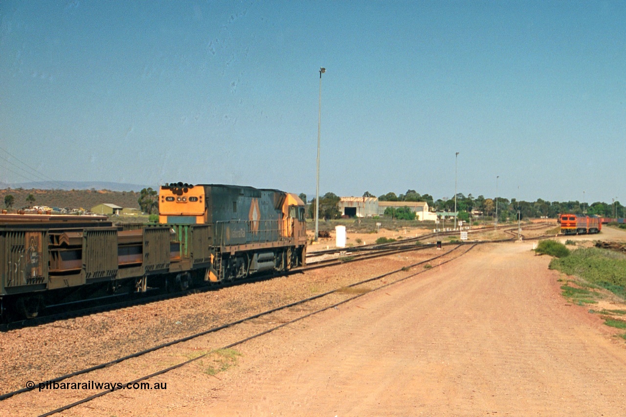 244-14
Port Augusta, Spencer Junction NR class NR 22 leads an UP short four waggon steel train off the Whyalla line. NR 22 is a Goninan built GE model Cv40-9i serial 7250-04/97-224.
