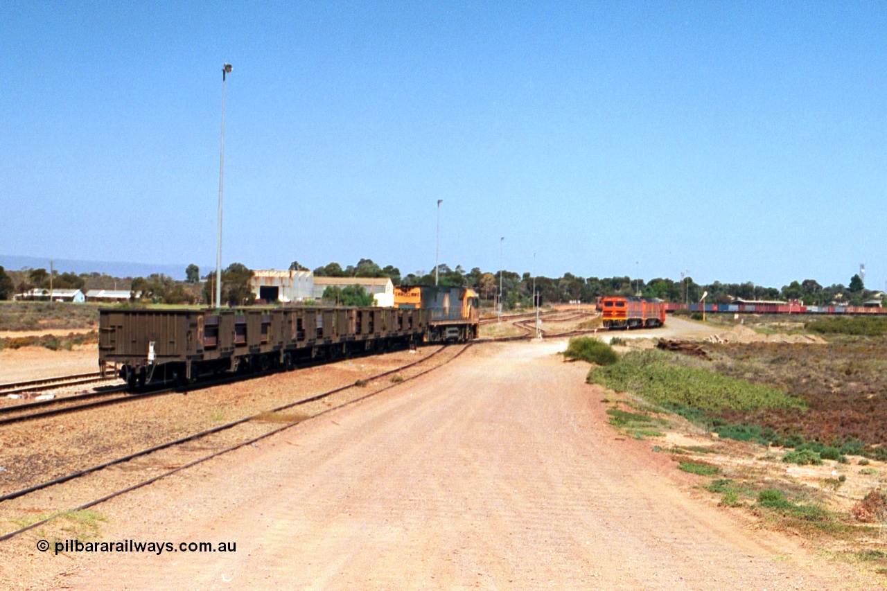244-15
Port Augusta, Spencer Junction NR class NR 22 leads an UP short four waggon steel train off the Whyalla line. NR 22 is a Goninan built GE model Cv40-9i serial 7250-04/97-224.
