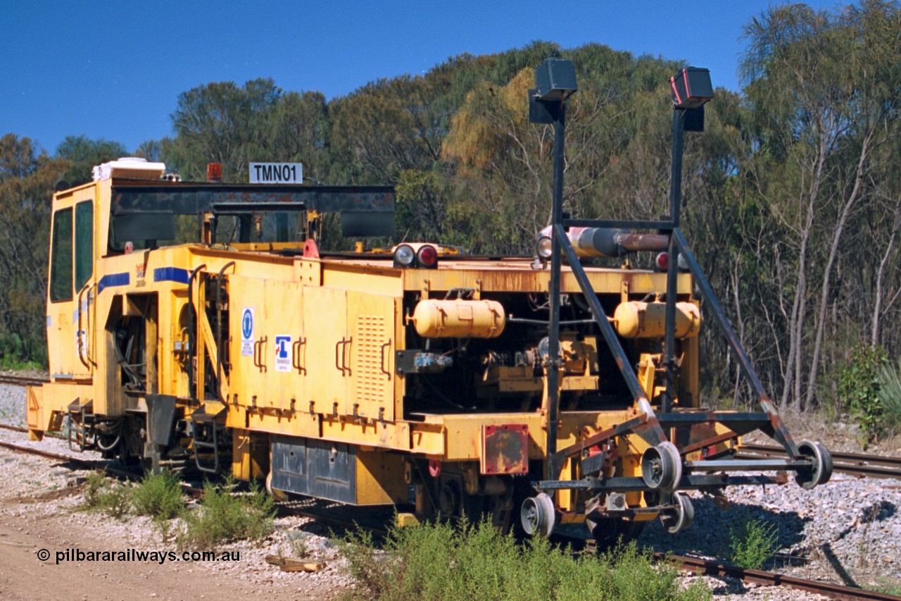 244-19
Coomunga, on the siding, Transfield track machine TMN 01 which is a track tamper. 6th April, 2003.
Keywords: track-machine;
