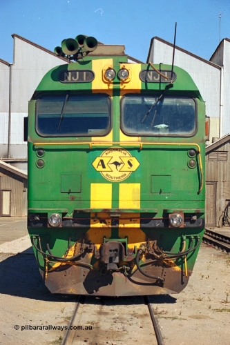 244-22
Port Lincoln loco workshops, still wearing the former owners AN livery, Australian Southern NJ class leader NJ 1 'Ben Chifley' Clyde Engineering EMD model JL22C serial 71-728, cab front view. 6th April, 2003
Keywords: NJ-class;NJ1;Clyde-Engineering-Granville-NSW;EMD;JL22C;71-728;