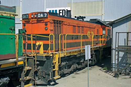 244-37
Port Lincoln loco workshops, wearing Australian Southern livery rebuild ALCo DA 7 started life as NSWGR 48 class 4813 AE Goodwin ALCo model DL531 serial 83713, rebuilt by Islington Workshops with long hood and parts from former 830 class 870 AE Goodwin ALCo model DL531 serial G6016-06 in 1998. B end roster view looking forward. April 6, 2003.
Keywords: DA-class;DA7;83713;Port-Augusta-WS;ALCo;DL531G/1;48-class;4813;rebuild;
