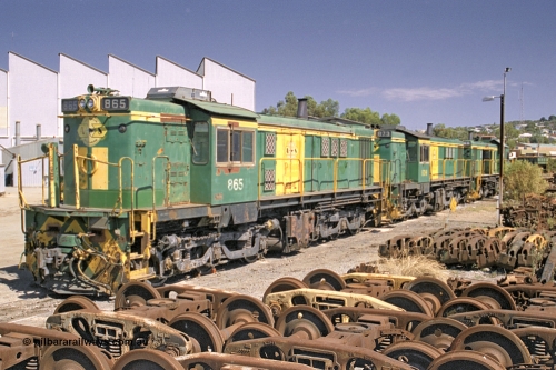 245-05
Port Lincoln loco workshops, still in former owner AN livery, Australian Southern 830 class locomotive 865 AE Goodwin ALCo model DL531 serial 84711, roster shot in multi-unit consist with sister unit 873 and DA class unit DA 6. April 6, 2003.
Keywords: 830-class;865;AE-Goodwin;ALCo;DL531;84711;