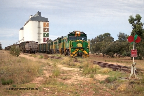 245-16
Wudinna, empty grain train shunts back into the grain siding with a trio of former Australian National Co-Co locomotives with rebuilt former AE Goodwin ALCo model DL531 830 class ex 839, serial no. 83730, rebuilt by Port Augusta Workshops to DA class, DA 4 leading two AE Goodwin ALCo model DL531 830 class units 842, serial no. 84140 and 851 serial no. 84137, 851 having been on the Eyre Peninsula since delivered in 1962. April 7, 2003.
Keywords: DA-class;DA4;83730;Port-Augusta-WS;ALCo;DL531G/1;830-class;839;rebuild;