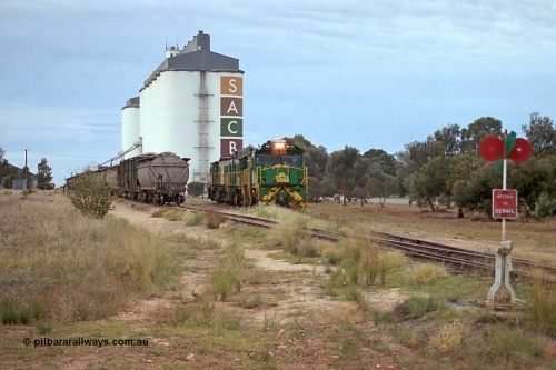 245-19
Wudinna, empty grain train locos shunt back towards the mainline having dropped waggons in the siding, a trio of former Australian National Co-Co locomotives with rebuilt former AE Goodwin ALCo model DL531 830 class ex 839, serial no. 83730, rebuilt by Port Augusta Workshops to DA class, DA 4 leading two AE Goodwin ALCo model DL531 830 class units 842, serial no. 84140 and 851 serial no. 84137, 851 having been on the Eyre Peninsula since delivered in 1962. April 7, 2003.
Keywords: DA-class;DA4;83730;Port-Augusta-WS;ALCo;DL531G/1;830-class;839;rebuild;