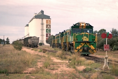 245-20
Wudinna, empty grain train locos shunt back towards the mainline having dropped waggons in the siding, a trio of former Australian National Co-Co locomotives with rebuilt former AE Goodwin ALCo model DL531 830 class ex 839, serial no. 83730, rebuilt by Port Augusta Workshops to DA class, DA 4 leading two AE Goodwin ALCo model DL531 830 class units 842, serial no. 84140 and 851 serial no. 84137, 851 having been on the Eyre Peninsula since delivered in 1962. April 7, 2003.
Keywords: DA-class;DA4;83730;Port-Augusta-WS;ALCo;DL531G/1;830-class;839;rebuild;