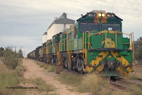 245-24
Wudinna, empty grain stands on the main awaiting departure north with a trio of former Australian National Co-Co locomotives with rebuilt former AE Goodwin ALCo model DL531 830 class ex 839, serial no. 83730, rebuilt by Port Augusta Workshops to DA class, leading two AE Goodwin ALCo model DL531 830 class units 842, serial no. 84140 and 851 serial no. 84137, 851 having been on the Eyre Peninsula since delivered in 1962. April 7, 2003.
Keywords: DA-class;DA4;83730;Port-Augusta-WS;ALCo;DL531G/1;830-class;839;rebuild;