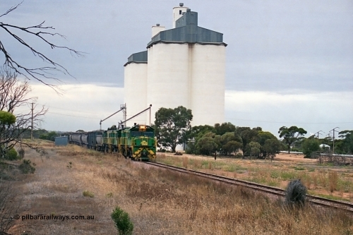 245-25
Yaninee, empty grain train behind a trio of former Australian National Co-Co locomotives with rebuilt former AE Goodwin ALCo model DL531 830 class ex 839, serial no. 83730, rebuilt by Port Augusta Workshops to DA class, leading two AE Goodwin ALCo model DL531 830 class units 842, serial no. 84140 and 851 serial no. 84137, 851 having been on the Eyre Peninsula since delivered in 1962, runs through express on the mainline. April 7, 2003.
Keywords: DA-class;DA4;83730;Port-Augusta-WS;ALCo;DL531G/1;830-class;839;rebuild;