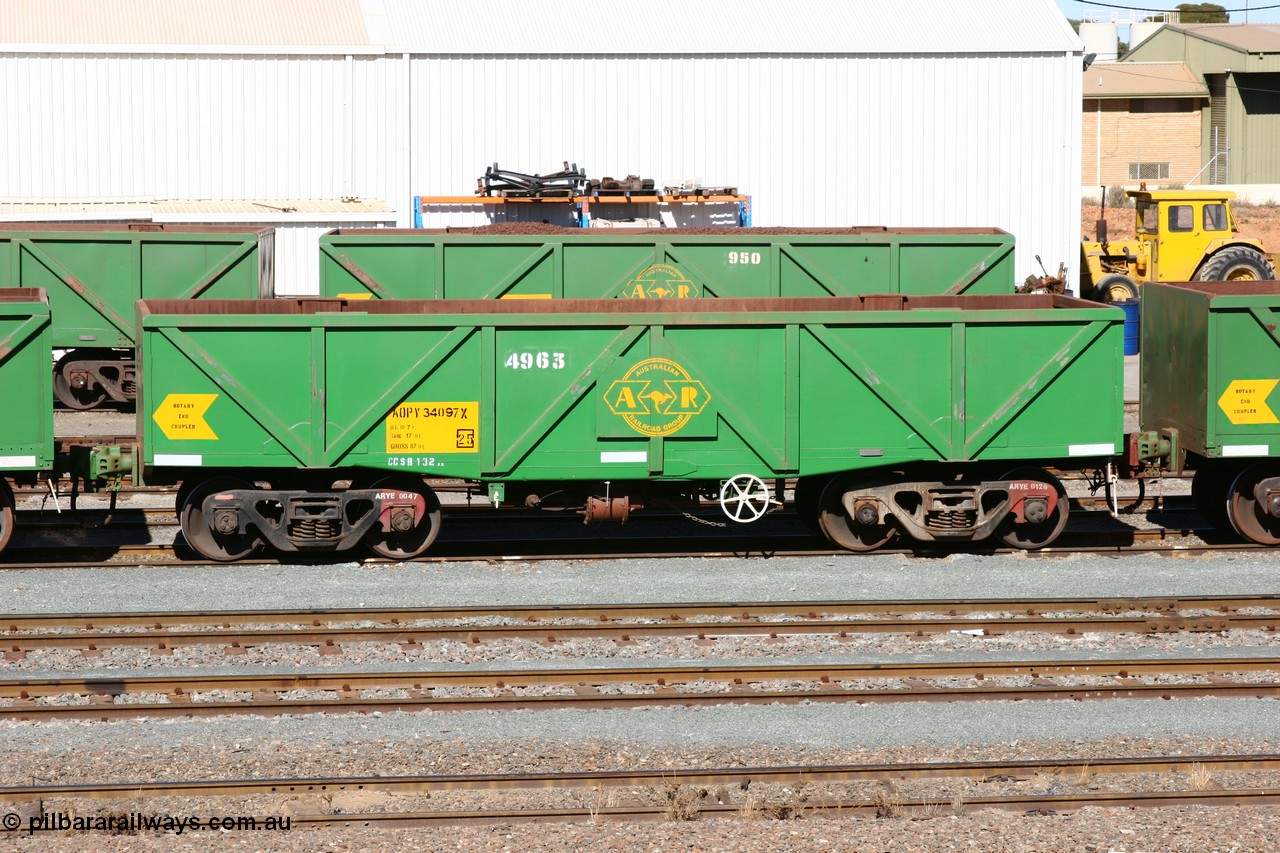 060528 4434
West Kalgoorlie, AOPY 34097, fleet number 4963, the 4 is a recent addition, is a drop floor version, one of seventy ex ANR coal waggons rebuilt from AOKF type by Bluebird Engineering SA in service with ARG on Koolyanobbing iron ore trains. They used to be three metres longer and originally built by Metropolitan Cammell Britain as GB type in 1952-55, 28th May 2006.
Keywords: AOPY-type;AOPY34097;Bluebird-Engineering-SA;Metropolitan-Cammell-Britain;GB-type;