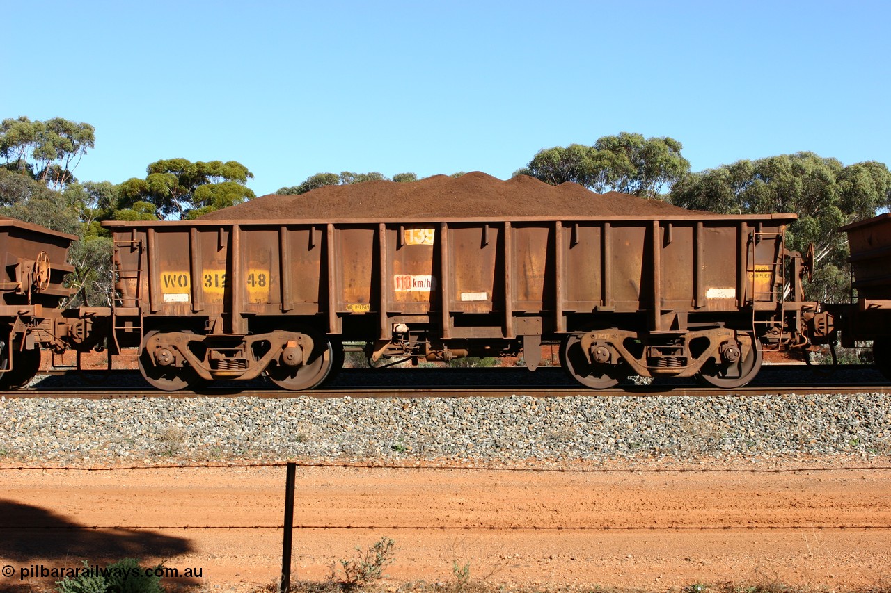060528 4594
WO type iron ore waggon WO 31248 is one of a batch of eighty six built by WAGR Midland Workshops between 1967 and March 1968 with fleet number 139 for Koolyanobbing iron ore operations, with a 75 ton and 1018 ft³ capacity, loaded with fines seen here at Bonnie Vale, 28th May 2006. This unit was converted to WOG for gypsum in late 1980s till 1990 then reclassed to WOS for superphosphate before being re-classed back to WO in 1994.
Keywords: WO-type;WO31248;WAGR-Midland-WS;