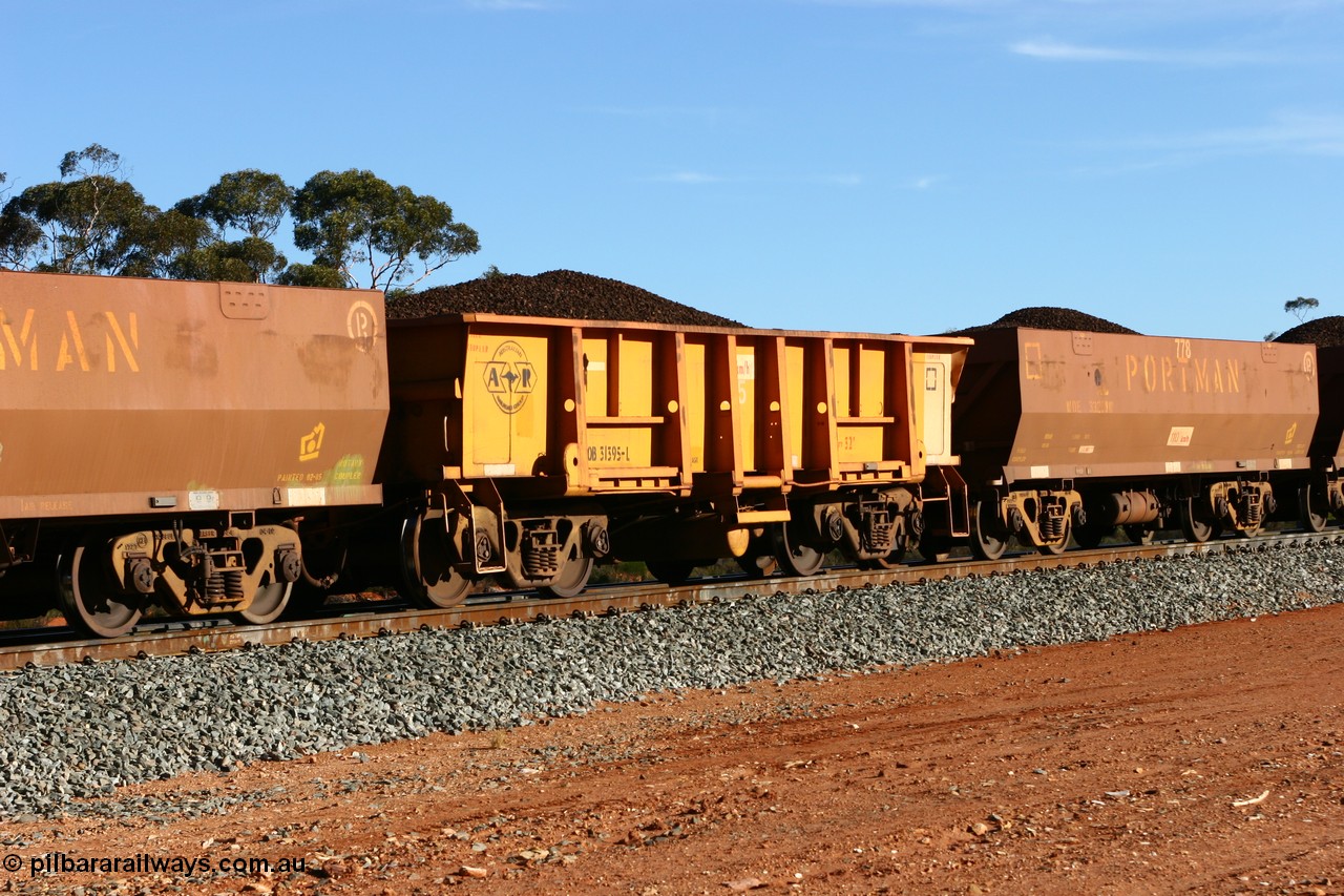 060530 4969
WOB type iron ore waggon WOB 31395 is one of a batch of twenty five built by Comeng WA between 1974 and 1975 and converted from Mt Newman high sided waggons by WAGR Midland Workshops with a capacity of 67 tons with fleet number 325 for Koolyanobbing iron ore operations. This waggon was also converted to a WSM type ballast hopper by re-fitting the cut down top section and having bottom discharge doors fitted, converted back to WOB in 1997. This is the first one to be repainted in ARG yellow, shows capacity of 32M³, loaded with lump ore at Binduli, 30th May 2006.
Keywords: WOB-type;WOB31395;Comeng-WA;WSM-type;Mt-Newman-Mining;