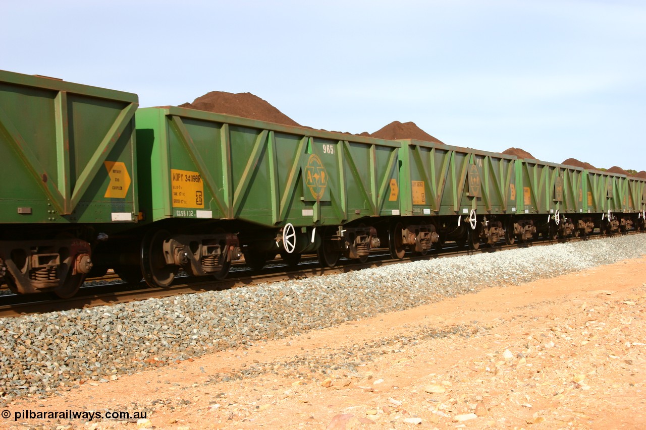 060531 5005
Binduli, AOPY 34098, fleet number 965 of the drop floor type, one of seventy ex ANR coal waggons rebuilt from AOKF type by Bluebird Engineering SA in service with ARG on Koolyanobbing iron ore trains. They used to be three metres longer and originally built by Metropolitan Cammell Britain as GB type in 1952-55, seen here in the consist with sister waggons of a loaded train bound for West Kalgoorlie, 31st May 2006.
Keywords: AOPY-type;AOPY34098;Bluebird-Engineering-SA;Metropolitan-Cammell-Britain;GB-type;