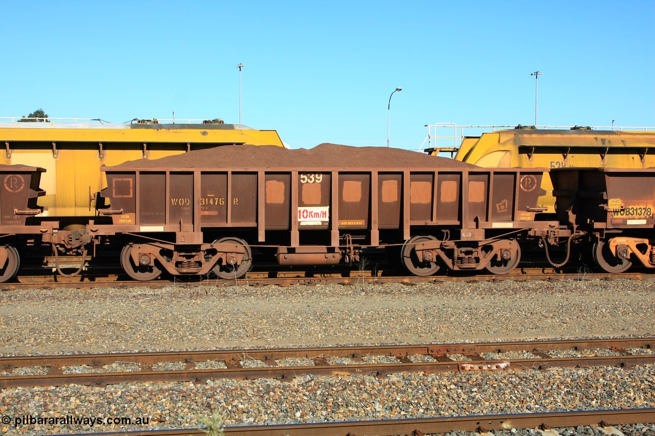 100602 8696
WOD type iron ore waggon WOD 31476 is one of a batch of sixty two built by Goninan WA between April and August 2000 with serial number 950086-048 and fleet number 539 for Koolyanobbing iron ore operations with a 75 ton capacity with a build date of 07/2000, for Portman Mining to cart their Koolyanobbing iron ore to Esperance, with the letters now painted over, loaded with fines, West Kalgoorlie 2nd June 2010.
Keywords: WOD-type;WOD31476;Goninan-WA;950086-048;