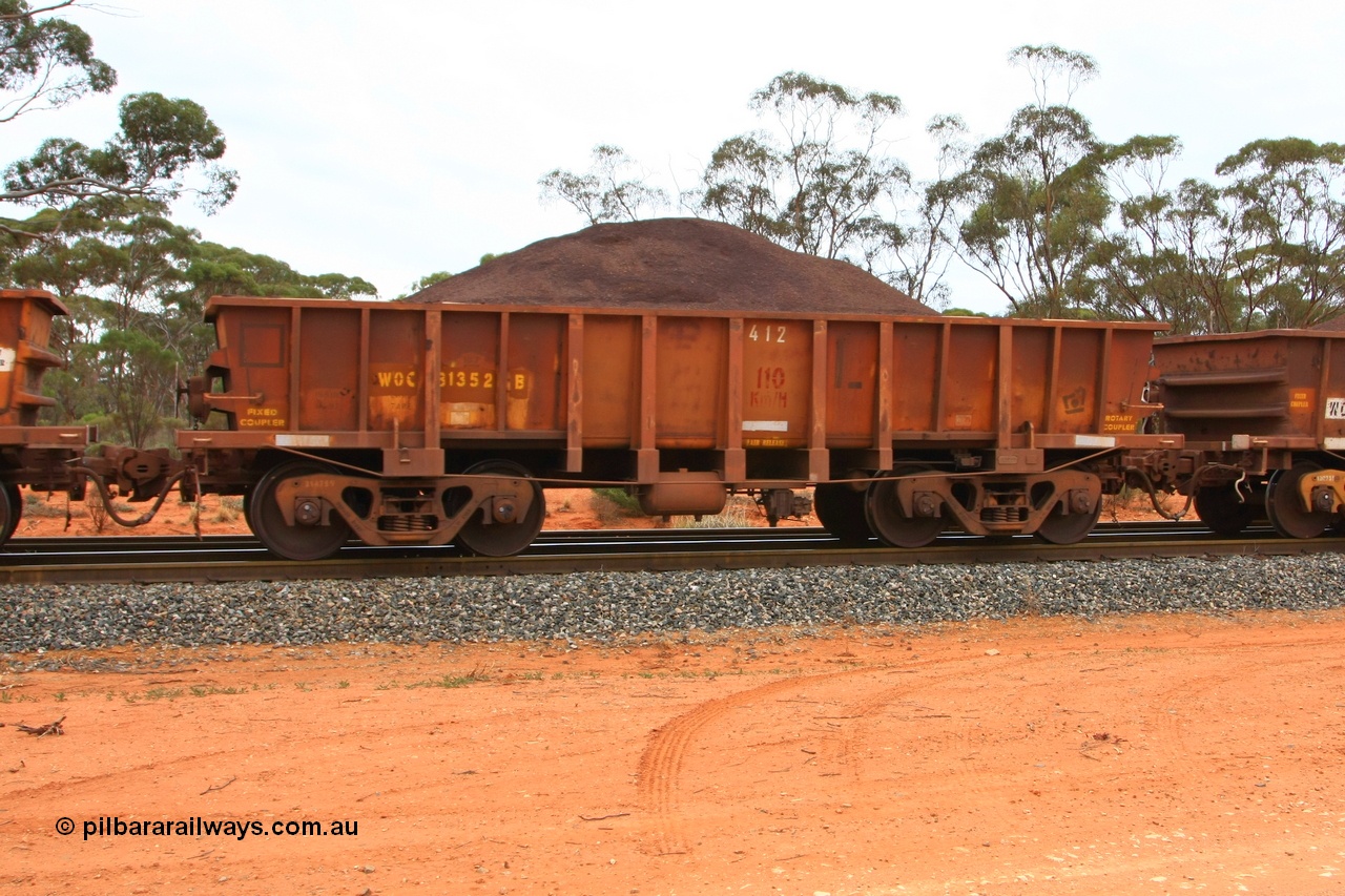 100605 9350
WOC type iron ore waggon WOC 31352 is one of a batch of thirty built by Goninan WA between October 1997 to January 1998 with fleet number 412 for Koolyanobbing iron ore operations with a 75 ton capacity and lettered for KIPL, Koolyanobbing Iron Pty Ltd with repainting of the middle panels leaving only the L visible, Binduli Triangle, loaded with fines, 5th June 2010.
Keywords: WOC-type;WOC31352;Goninan-WA;