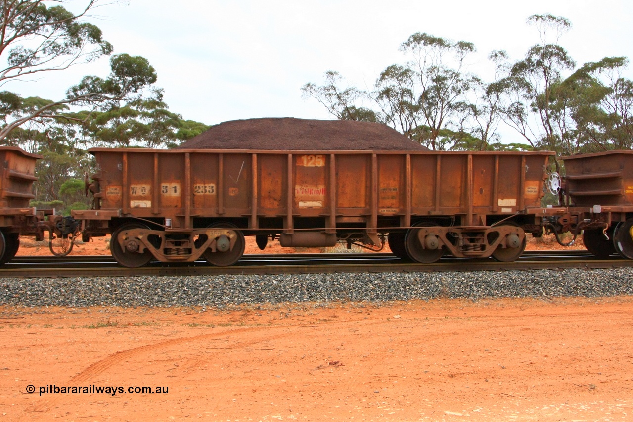 100605 9362
WO type iron ore waggon WO 31233 is one of a batch of eighty six built by WAGR Midland Workshops between 1967 and March 1968 with fleet number 125 for Koolyanobbing iron ore operations, with a 75 ton and 1018 ft³ capacity, Binduli Triangle, loaded with fines, 5th June 2010. This unit was converted to WOC for coal in 1986 till 1994 when it was re-classed back to WO.
Keywords: WO-type;WO31233;WAGR-Midland-WS;