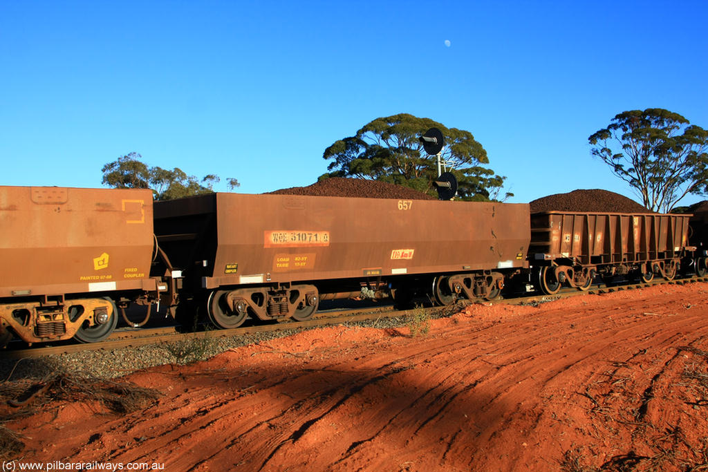 100731 02299
WOE type iron ore waggon WOE 31071 is one of a batch of one hundred and thirty built by Goninan WA between March and August 2001 with serial number 950092-061 and fleet number 657 for Koolyanobbing iron ore operations, on loaded train 6413 at Binduli Triangle, 31st July 2010.
Keywords: WOE-type;WOE31071;Goninan-WA;950092-061;