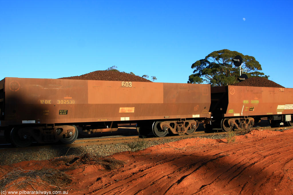 100731 02301
WOE type iron ore waggon WOE 30253 is one of a batch of one hundred and thirty built by Goninan WA between March and August 2001 with serial number 950092-003 and fleet number 603 for Koolyanobbing iron ore operations of Portman Mining, on loaded train 6413 at Binduli Triangle, 31st July 2010.
Keywords: WOE-type;WOE30253;Goninan-WA;950092-003;