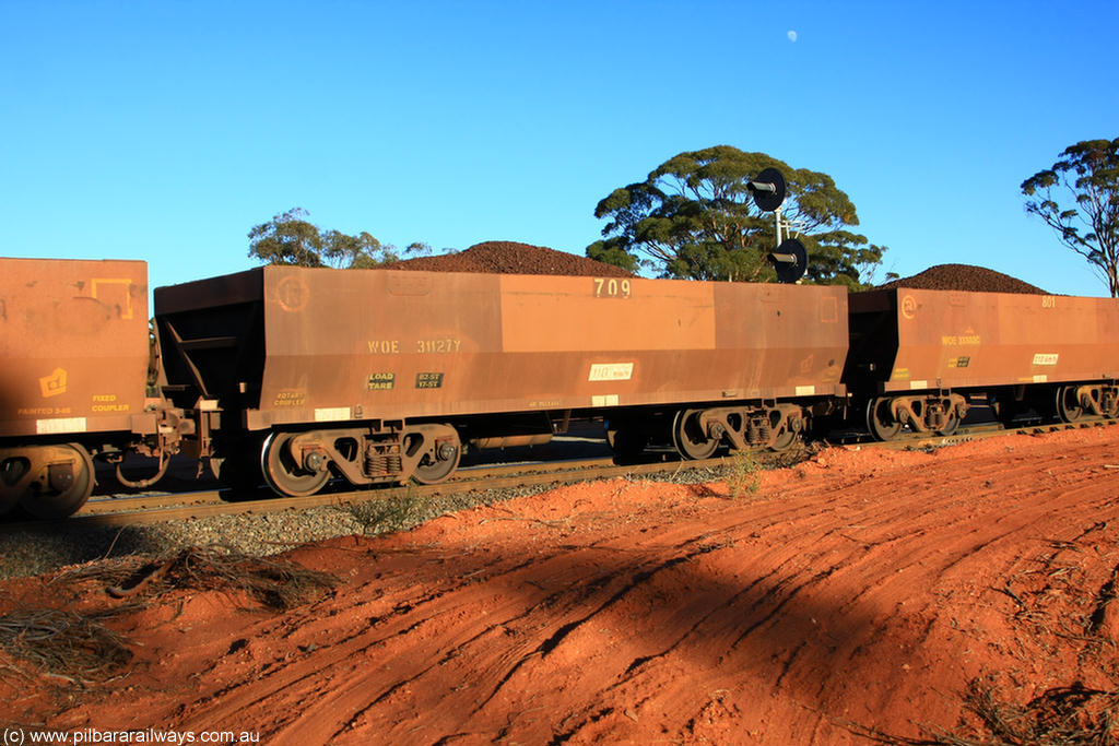 100731 02325
WOE type iron ore waggon WOE 31127 is one of a batch of one hundred and thirty built by Goninan WA between March and August 2001 with serial number 950092-117 and fleet number 709 for Koolyanobbing iron ore operations, on loaded train 6413 at Binduli Triangle, 31st July 2010.
Keywords: WOE-type;WOE31127;Goninan-WA;950092-117;