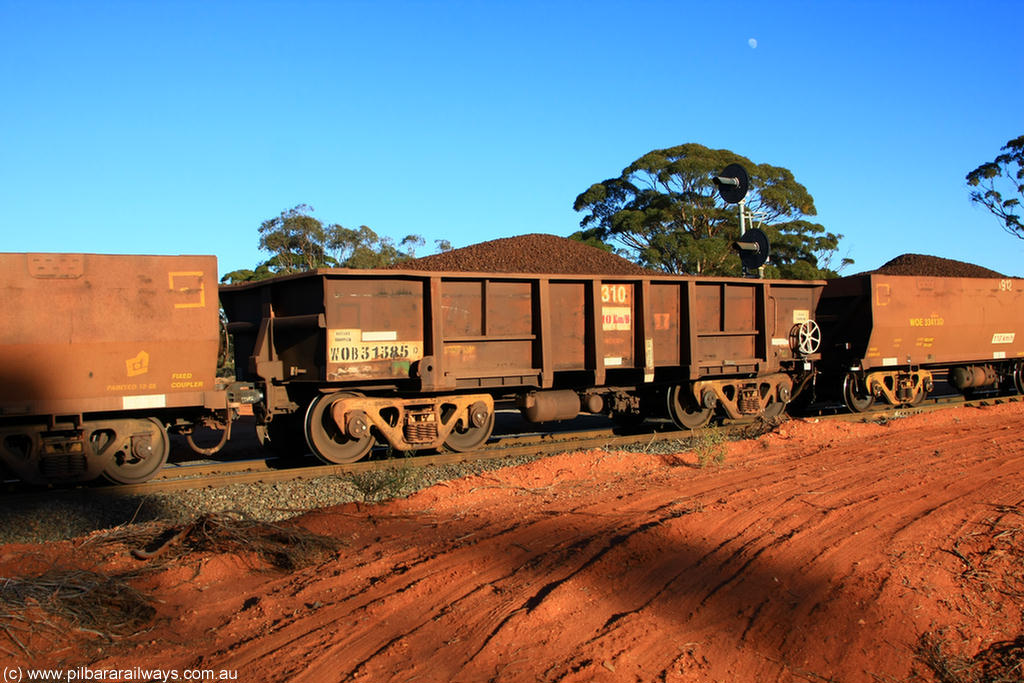 100731 02336
WOB type iron ore waggon WOB 31385 is one of a batch of twenty five built by Comeng WA between 1974 and 1975 and converted from Mt Newman high sided waggons by WAGR Midland Workshops with a capacity of 67 tons with fleet number 310 for Koolyanobbing iron ore operations, on loaded train 6413 at Binduli Triangle, 31st July 2010.
Keywords: WOB-type;WOB31385;Comeng-WA;Mt-Newman-Mining;