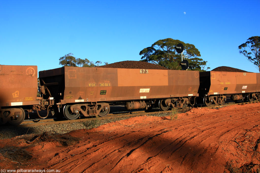 100731 02339
WOE type iron ore waggon WOE 31088 is one of a batch of one hundred and thirty built by Goninan WA between March and August 2001 with serial number 950092-078 and fleet number 673 for Koolyanobbing iron ore operations, on loaded train 6413 at Binduli Triangle, 31st July 2010.
Keywords: WOE-type;WOE31088;Goninan-WA;950092-078;