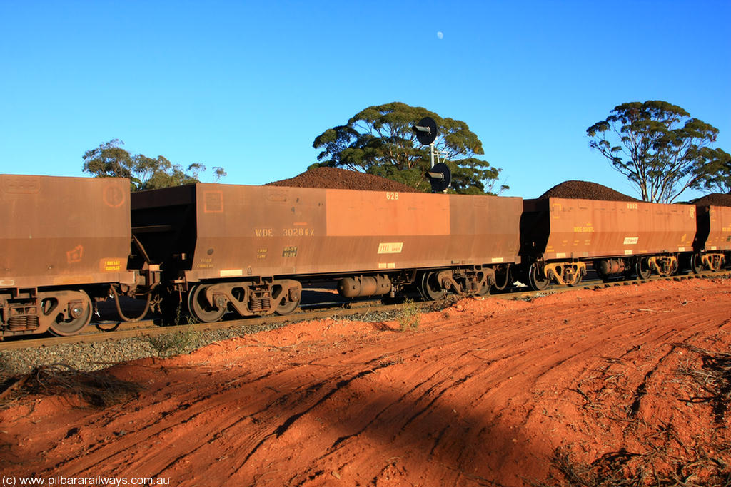 100731 02371
WOE type iron ore waggon WOE 30286 is one of a batch of one hundred and thirty built by Goninan WA between March and August 2001 with serial number 950092-036 and fleet number 628 for Koolyanobbing iron ore operations, on loaded train 6413 at Binduli Triangle, 31st July 2010.
Keywords: WOE-type;WOE30286;Goninan-WA;950092-036;