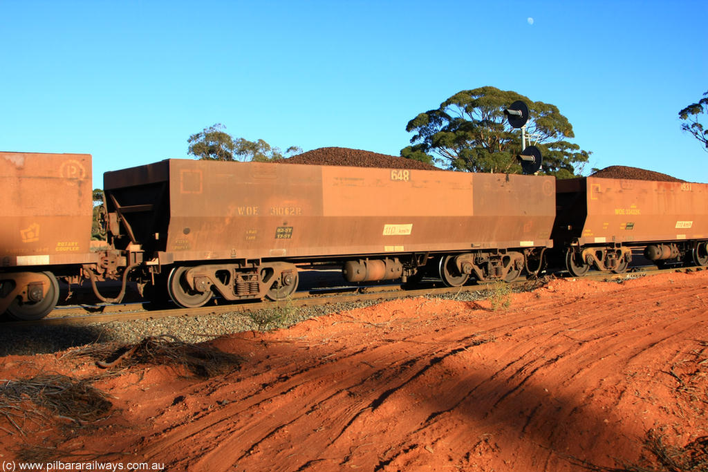 100731 02385
WOE type iron ore waggon WOE 31062 is one of a batch of one hundred and thirty built by Goninan WA between March and August 2001 with serial number 950092-052 and fleet number 648 for Koolyanobbing iron ore operations, on loaded train 6413 at Binduli Triangle, 31st July 2010.
Keywords: WOE-type;WOE31062;Goninan-WA;950092-052;