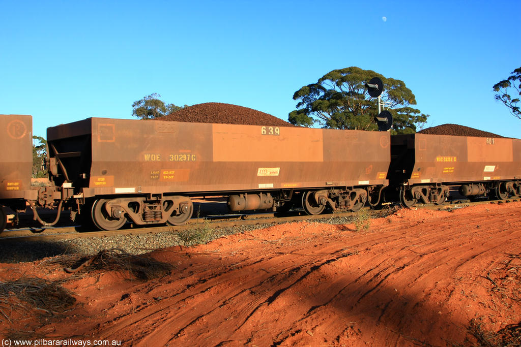 100731 02389
WOE type iron ore waggon WOE 30297 is one of a batch of one hundred and thirty built by Goninan WA between March and August 2001 with serial number 950092-047 and fleet number 639 for Koolyanobbing iron ore operations, on loaded train 6413 at Binduli Triangle, 31st July 2010.
Keywords: WOE-type;WOE30297;Goninan-WA;950092-047;