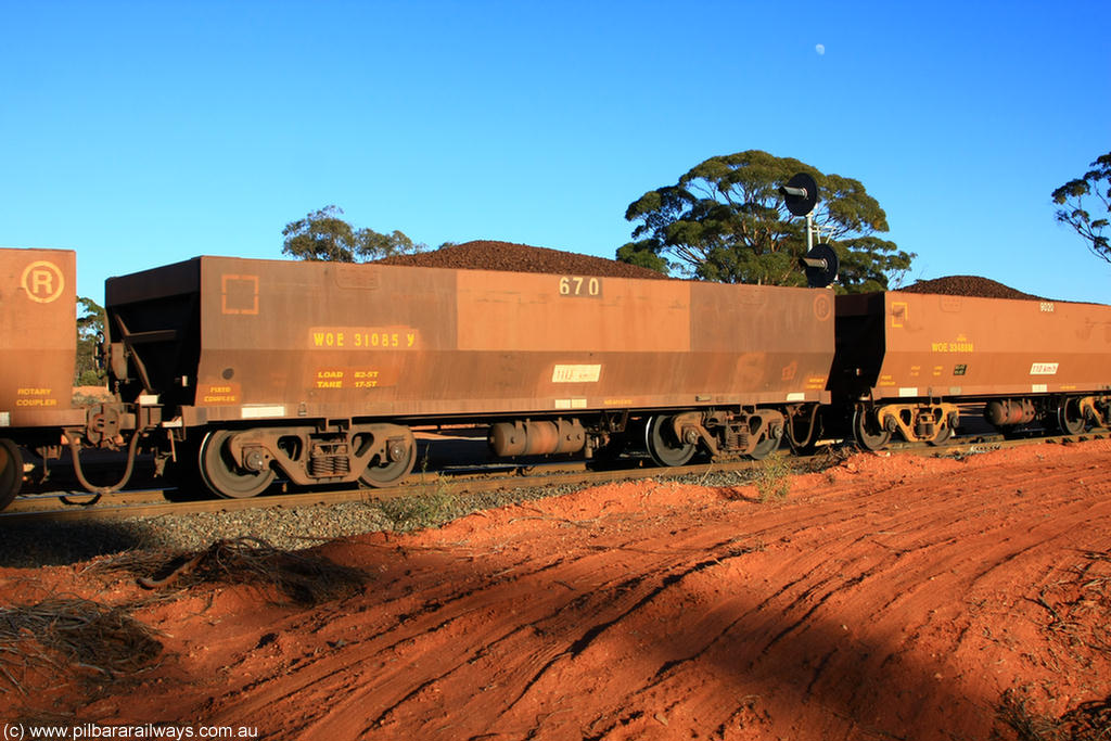 100731 02396
WOE type iron ore waggon WOE 31085 is one of a batch of one hundred and thirty built by Goninan WA between March and August 2001 with serial number 950092-075 and fleet number 670 for Koolyanobbing iron ore operations, on loaded train 6413 at Binduli Triangle, 31st July 2010.
Keywords: WOE-type;WOE31085;Goninan-WA;950092-075;