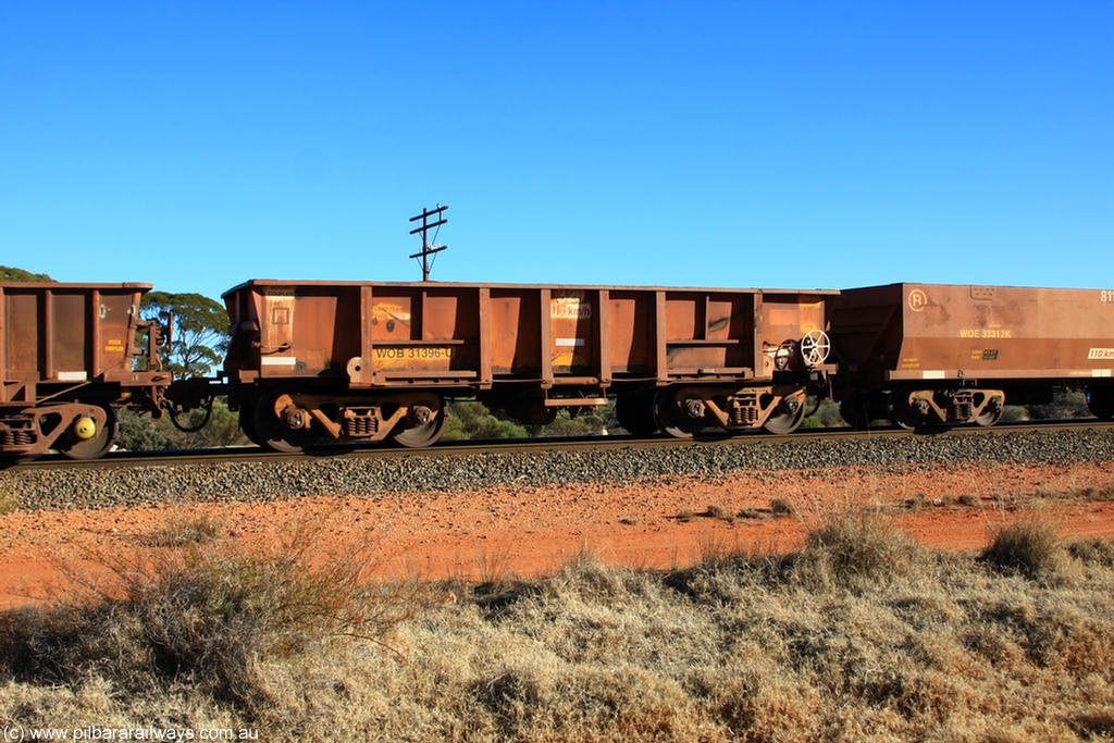 100731 02422
WOB type iron ore waggon WOB 31396 is one of a batch of twenty five built by Comeng WA between 1974 and 1975 and converted from Mt Newman high sided waggons by WAGR Midland Workshops with a capacity of 67 tons with fleet number 320 for Koolyanobbing iron ore operations. This waggon was also converted to a WSM type ballast hopper by re-fitting the cut down top section and having bottom discharge doors fitted, converted back to WOB in 1998, on empty train 6418 at Binduli Triangle, 31st July 2010.
Keywords: WOB-type;WOB31396;Comeng-WA;WSM-type;Mt-Newman-Mining;