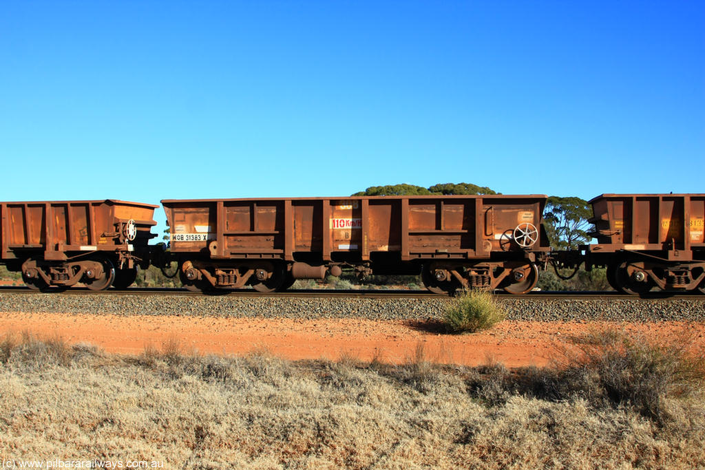 100731 02435
WOB type iron ore waggon WOB 31383 is one of a batch of twenty five built by Comeng WA between 1974 and 1975 and converted from Mt Newman high sided waggons by WAGR Midland Workshops with a capacity of 67 tons with fleet number 308 for Koolyanobbing iron ore operations, on empty train 6418 at Binduli Triangle, 31st July 2010.
Keywords: WOB-type;WOB31383;Comeng-WA;Mt-Newman-Mining;