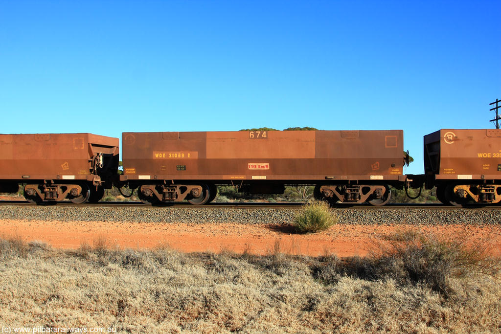 100731 02461
WOE type iron ore waggon WOE 31089 is one of a batch of one hundred and thirty built by Goninan WA between March and August 2001 with serial number 950092-079 and fleet number 674 for Koolyanobbing iron ore operations, on empty train 6418 at Binduli Triangle, 31st July 2010.
Keywords: WOE-type;WOE31089;Goninan-WA;950092-079;